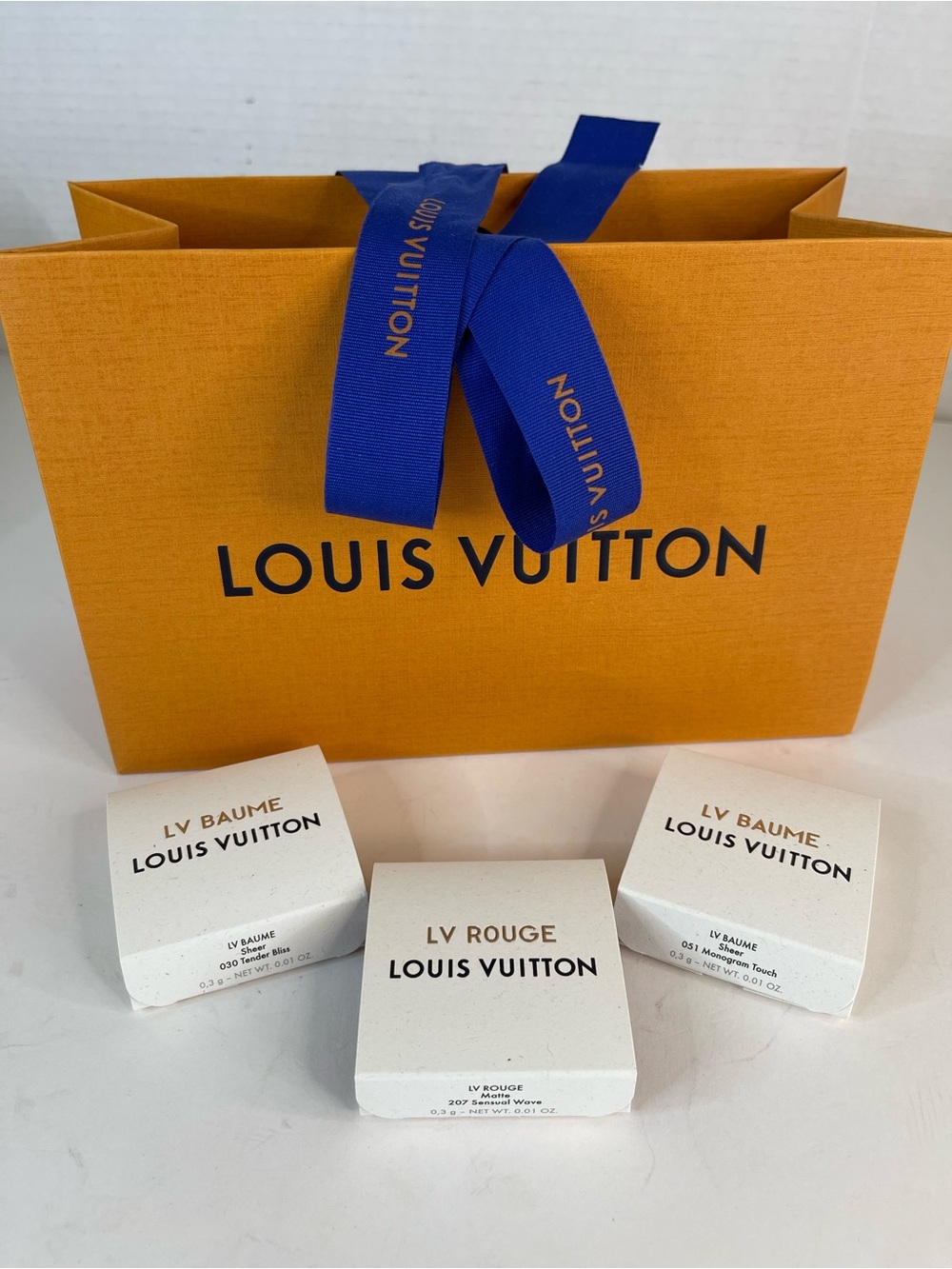 Louis Vuitton gift bag with three lipstick samples